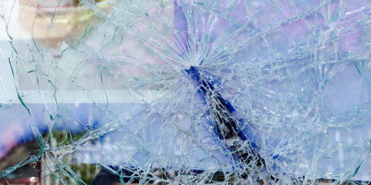 Cracked and broken glass window of a car